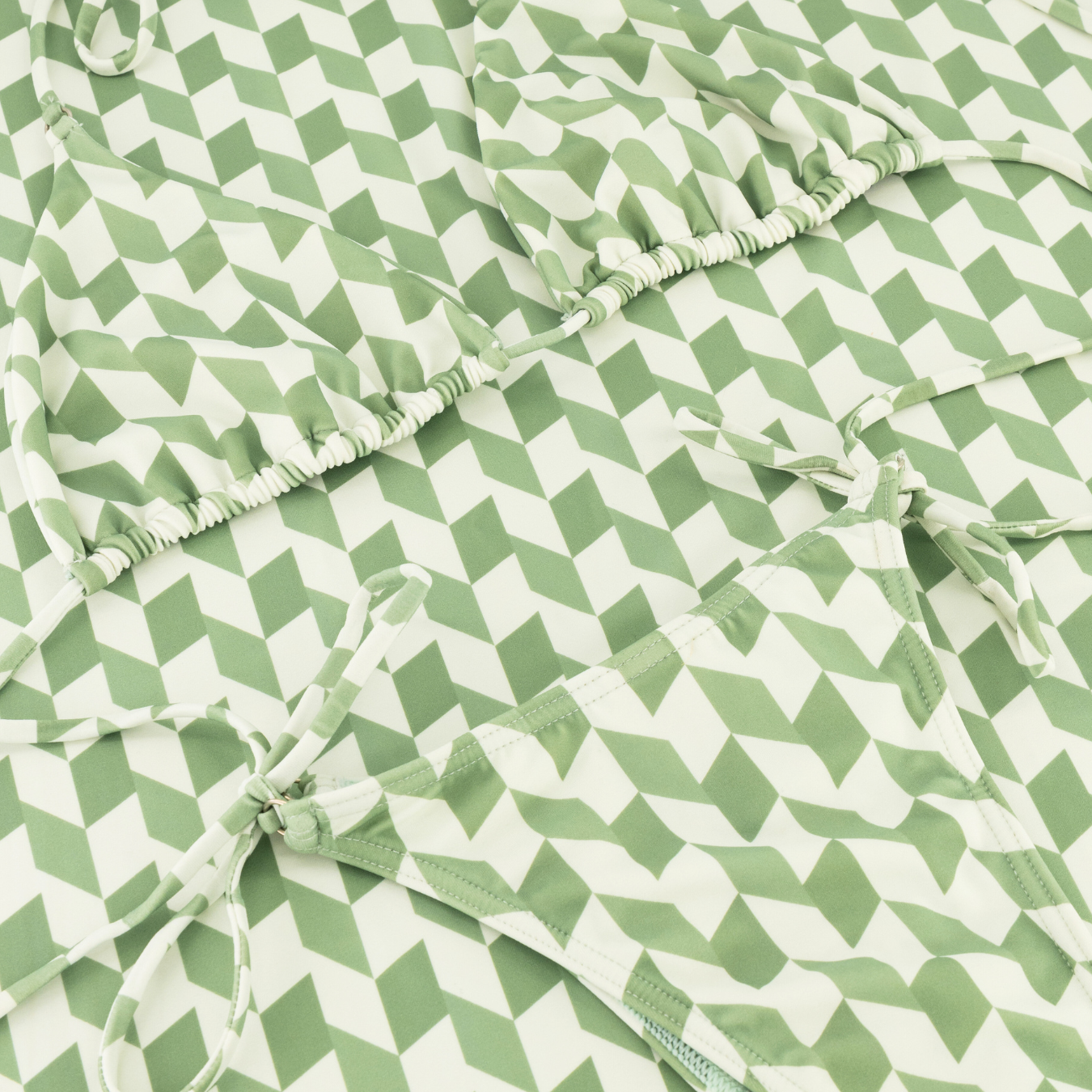 A green and white hounds tooth triangle bikini set with adjustable cups and straps