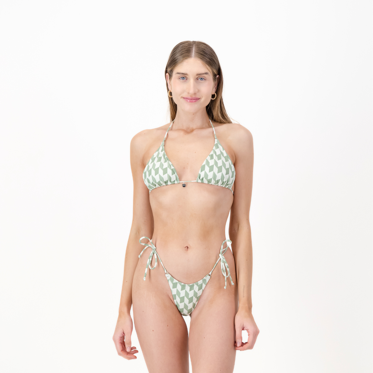 A woman wearing a green and white hounds tooth triangle bikini set